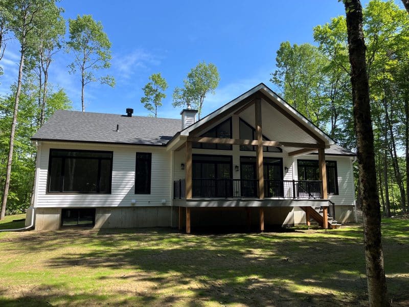 A ProFab realization of a prestigious, custom-built, contemporary farmhouse-style bungalow. Exterior view.