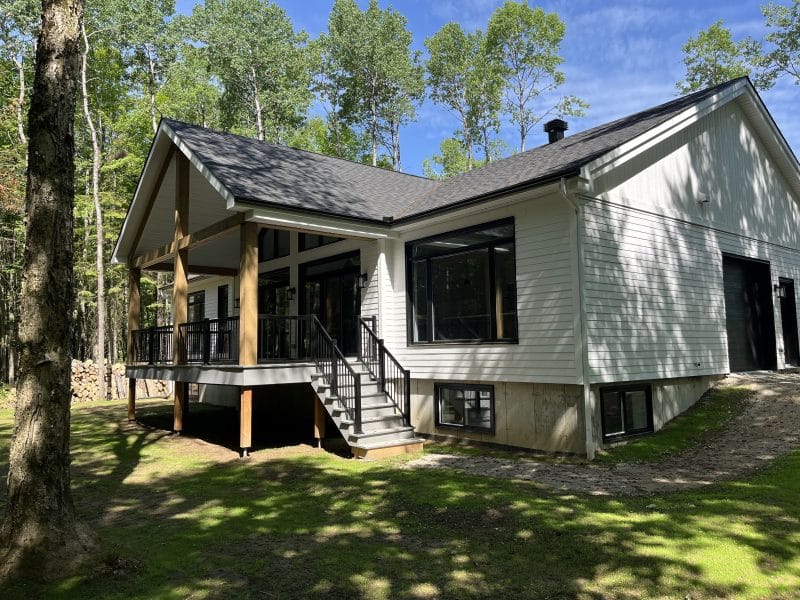 A ProFab realization of a prestigious, custom-built, contemporary farmhouse-style bungalow. Exterior view.