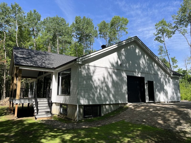 A ProFab realization of a prestigious, custom-built, contemporary farmhouse-style bungalow. Exterior view.