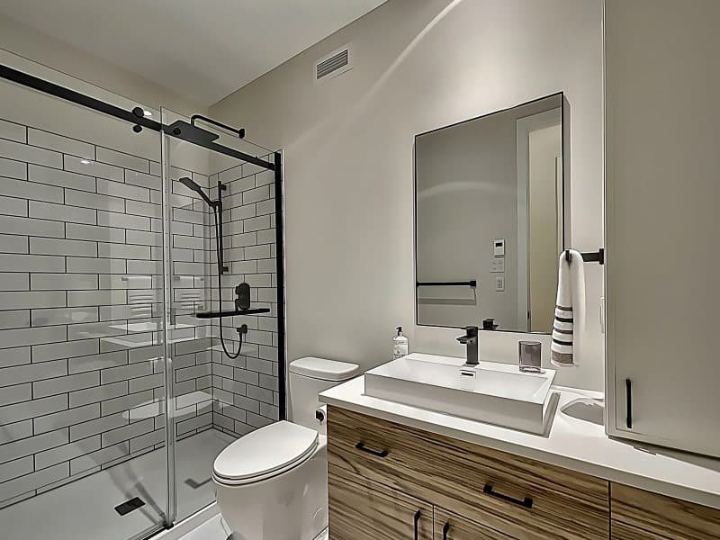 A ProFab home realization of a prestigious custom-built contemporary farmhouse style bungalow. View from the bathroom.