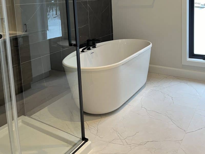 A ProFab home realization of a prestigious custom-built contemporary farmhouse style bungalow. View from the bathroom.