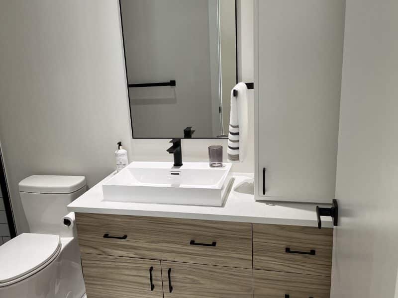 A ProFab home realization of a prestigious custom-built contemporary farmhouse style bungalow. View from the bathroom.