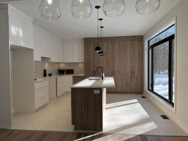 A ProFab home realization of a prestigious custom-built contemporary farmhouse style bungalow. View from the kitchen.